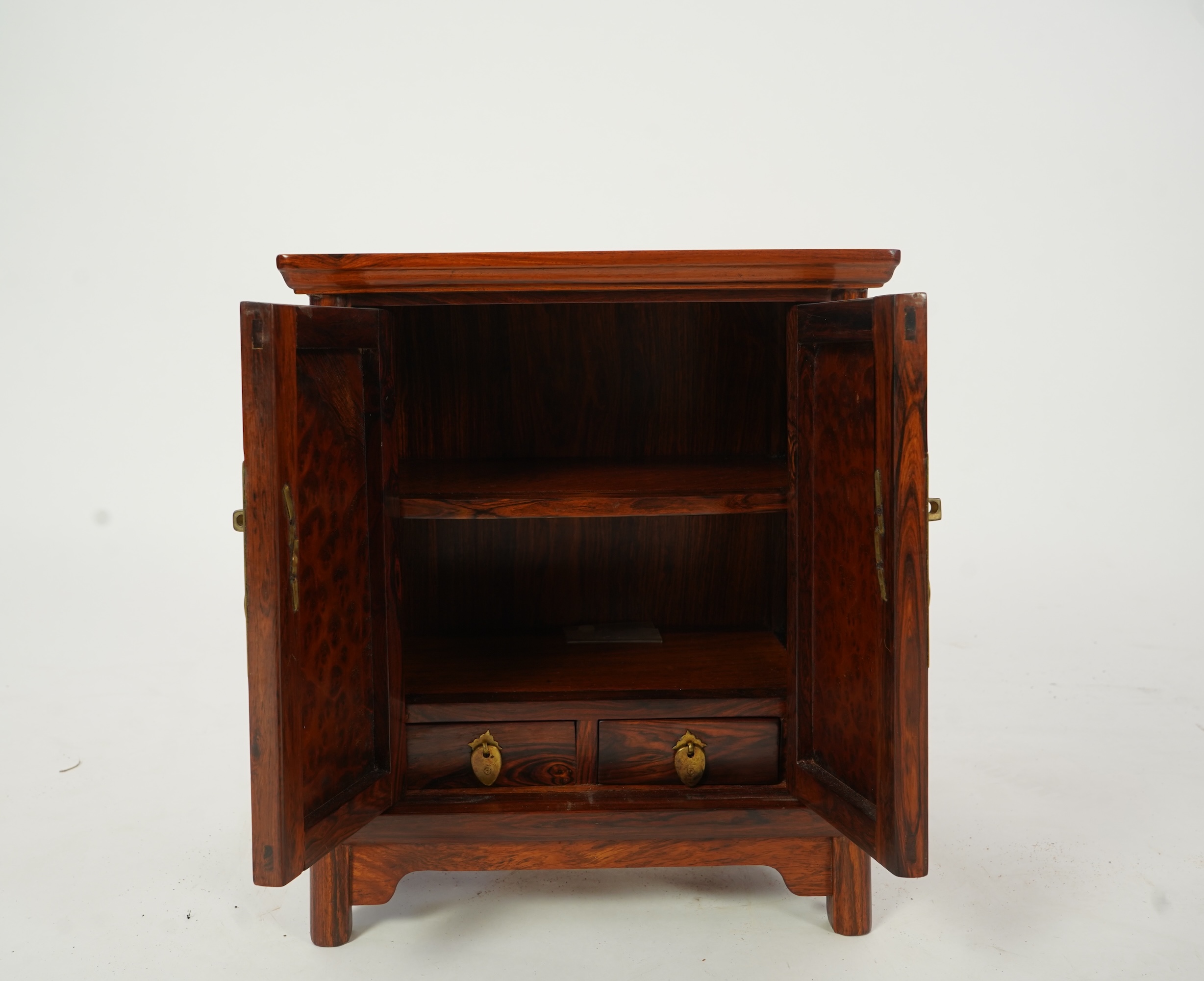 A Chinese huanghuali and burrwood panelled round-corner kang cabinet, 20th century